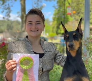 Junior Handler with her Doberman Pinscher