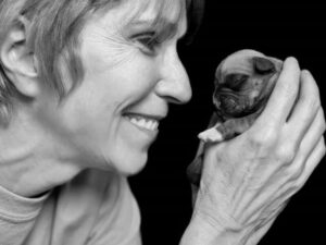 Paula Vandervoort with her Boxer puppy.